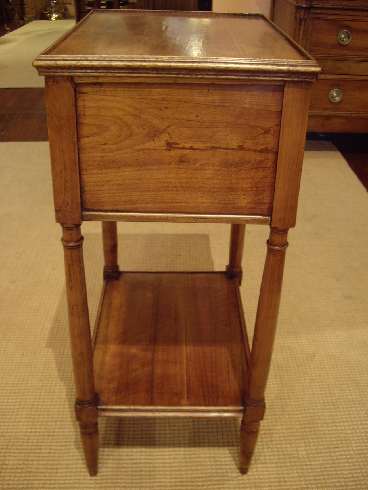 French Provincial 19th century two-drawer side table with one shelf.
