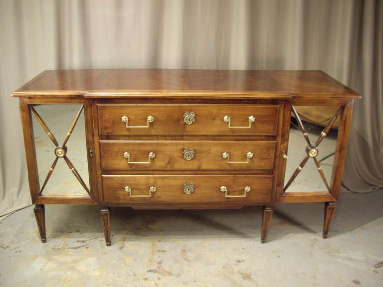 Very well constructed walnut 1920's French sideboard with 3 drawers and 2 mirrored doors.