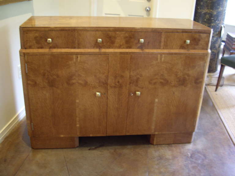 Elegant walnut Art Deco Buffet.  Four drawers and two doors. Beautifully constructed with secondary wood of draws and interior of mahogany.
