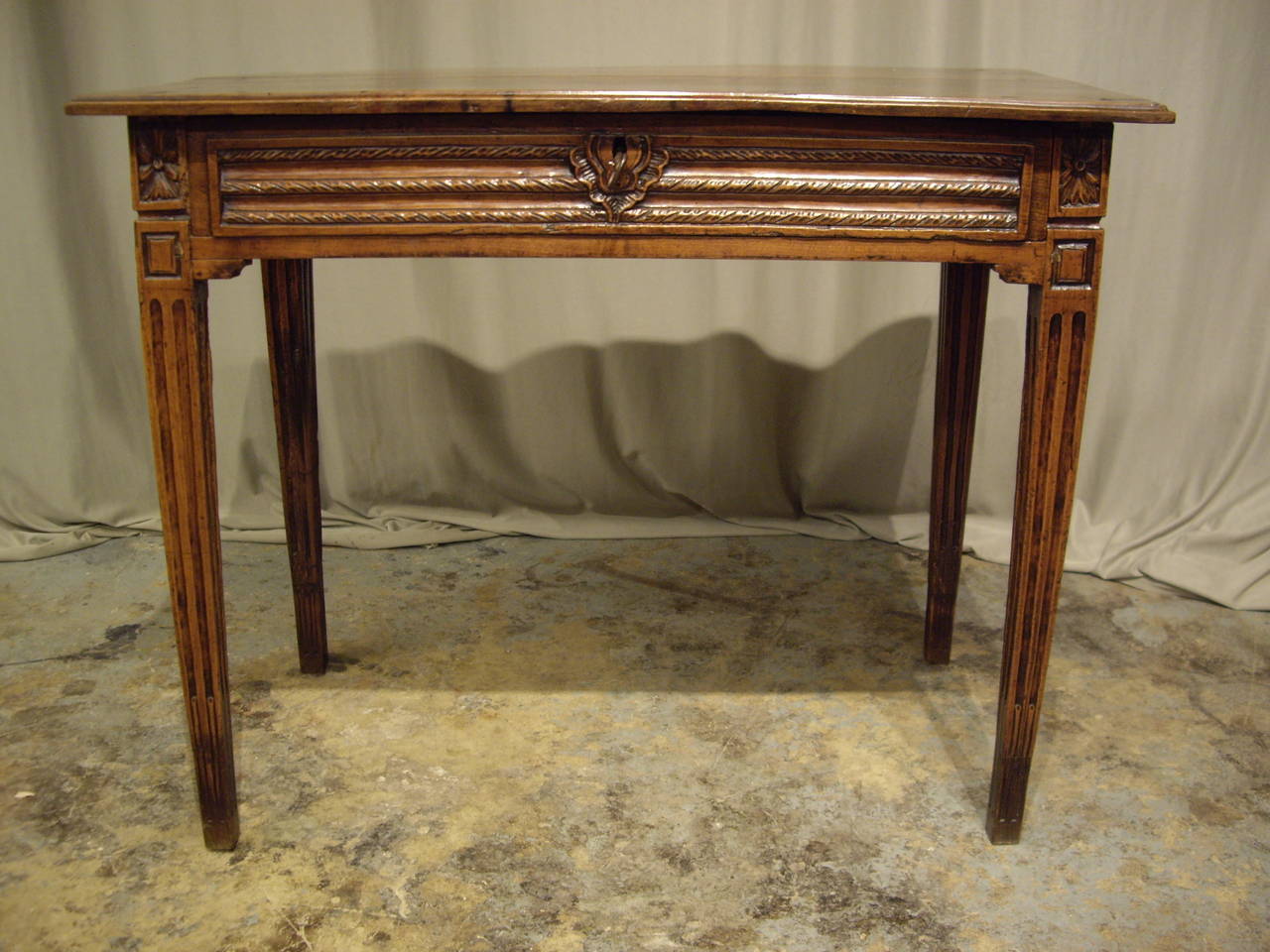 Early 19th century walnut Louis XVI side table with a lovely warm patina. It has been carefully restored and French polished.