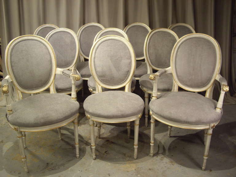 10 painted  Gustavian style 19th century painted dining chairs, 8 side and 2 arm. Very nice new gray  cotton velvet fabric and upholstery.
Measurements of arm chairs.39.50