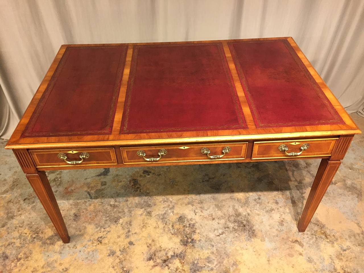 Very nice leather top late 19th century three drawer walnut and mahogany partners desk. Identical on both sides.  Only one side has drawers that pull out.  Original nicely worn leather tops. Inlaid line inlay with ivory escutcheons.
