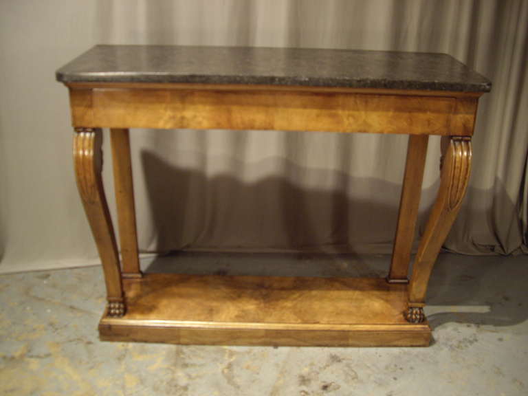 Narrow French Empire walnut console with a marble top and walnut mirror.  Carefully restored.
Mirror measurements;  28.25 inches X 39 inches.