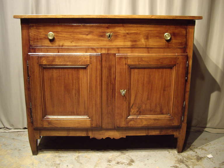 Beautiful 19th century French walnut buffet with lovely warm patina. The buffet has two doors and one large draw.