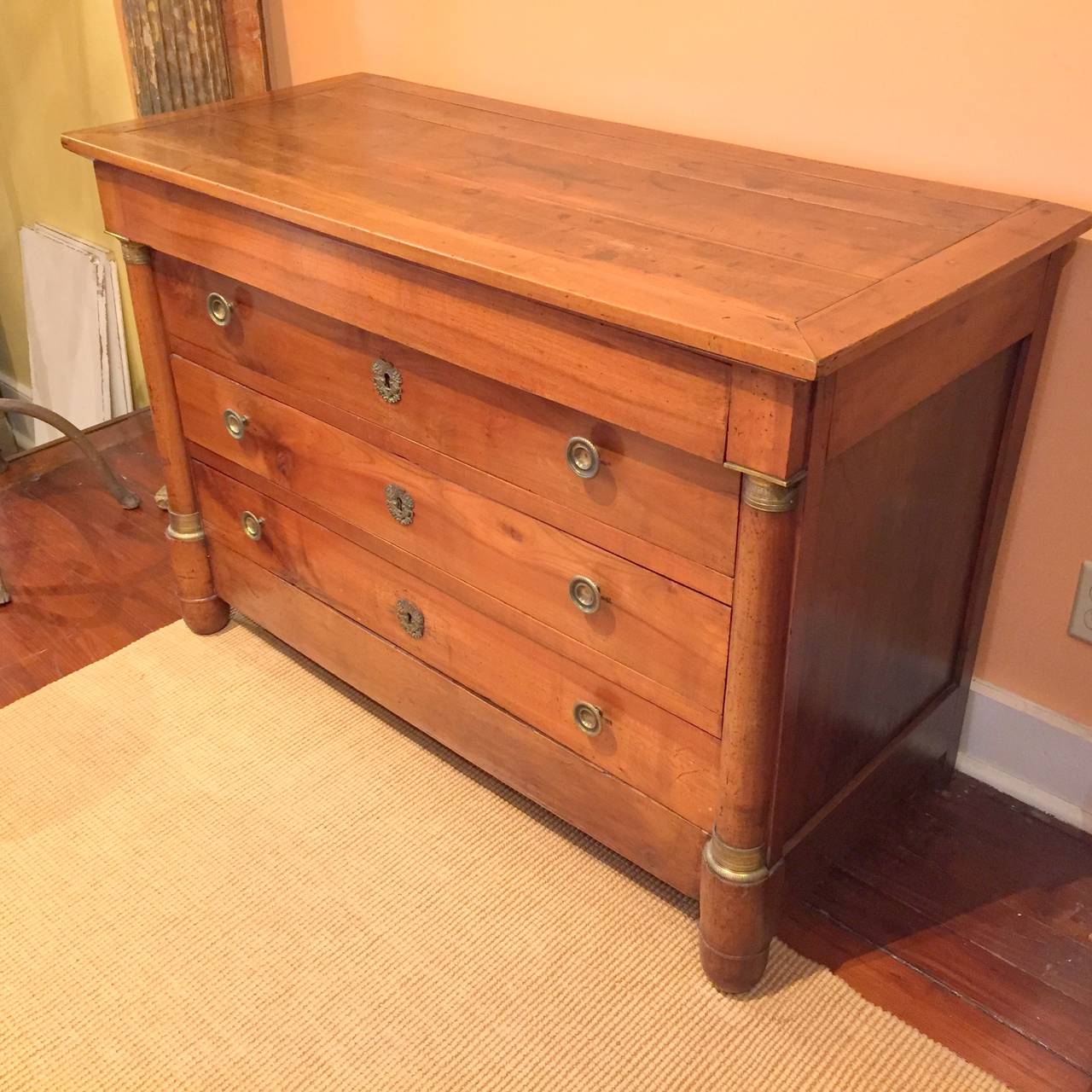 French Empire 19th century walnut four-drawer commode.