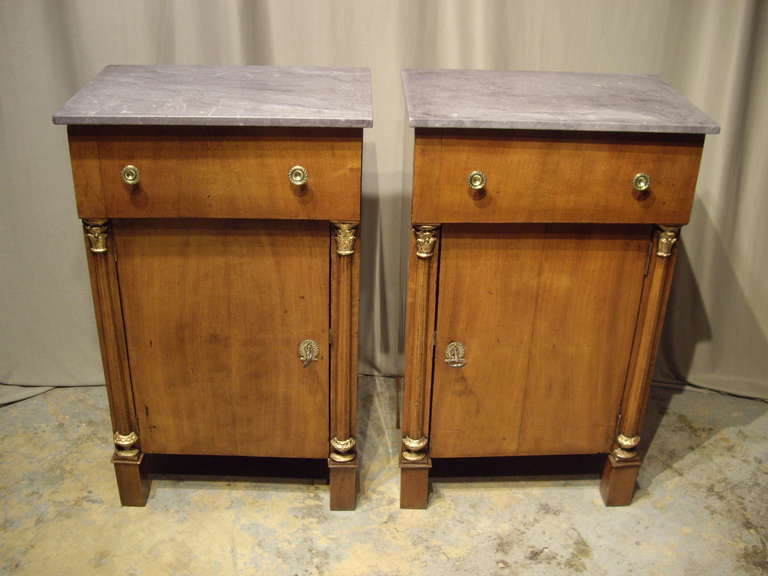 19th century Second Empire French walnut side cabinets with marble tops.