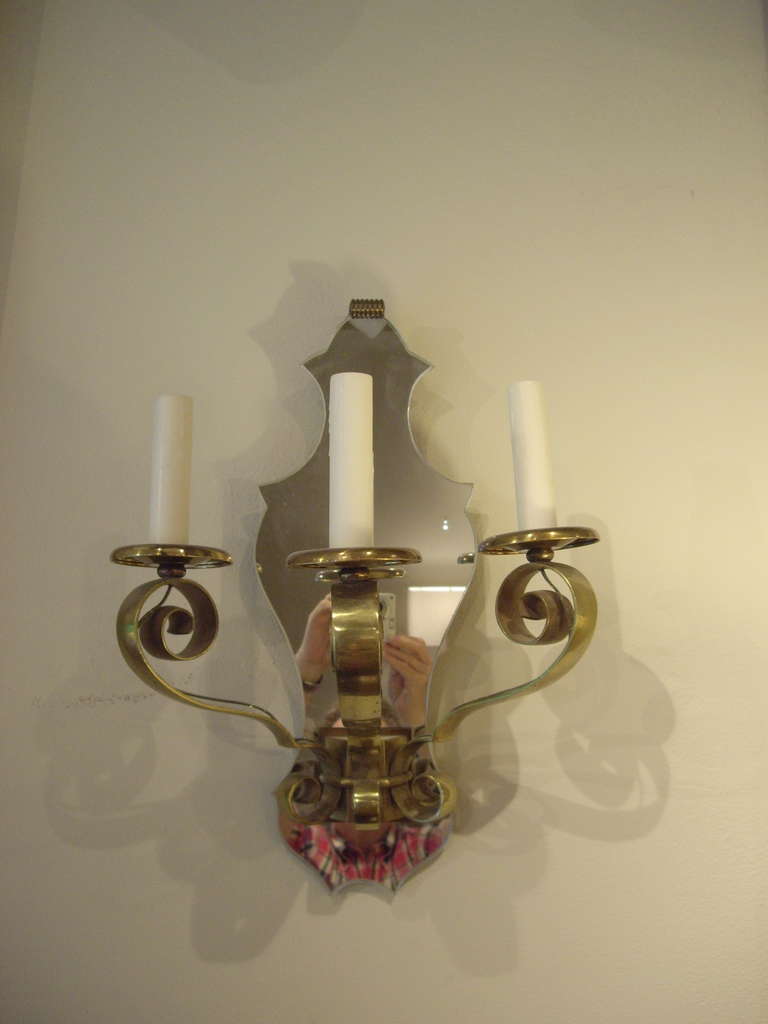 Pair of high quality, 1920s French, three light brass and mirror wall sconces.