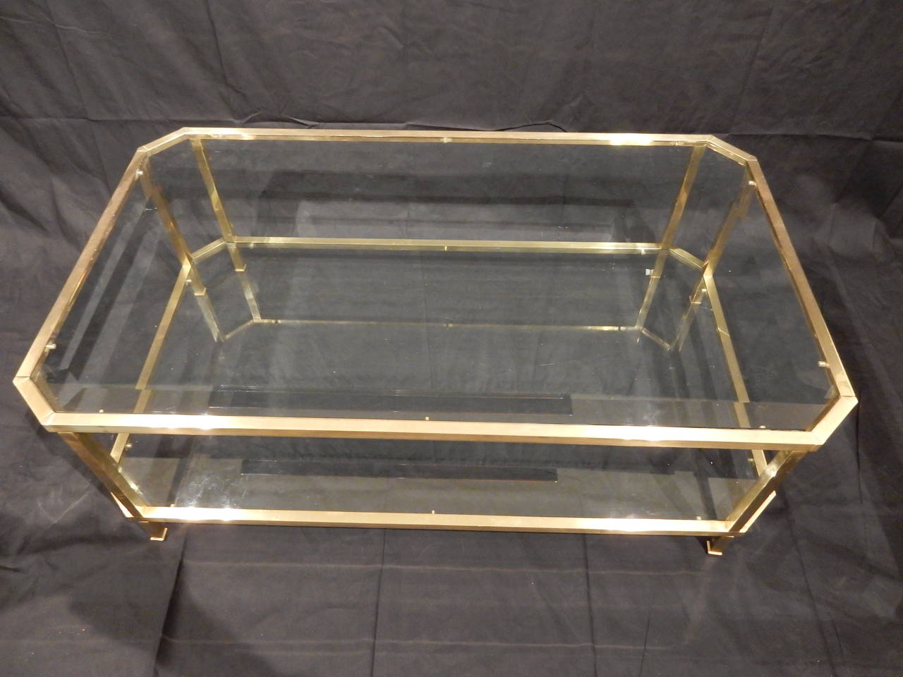 Beautiful high quality brass coffee table. Made with careful attention to detail and quality workmanship. Top glass bevelled with plain glass on shelf.