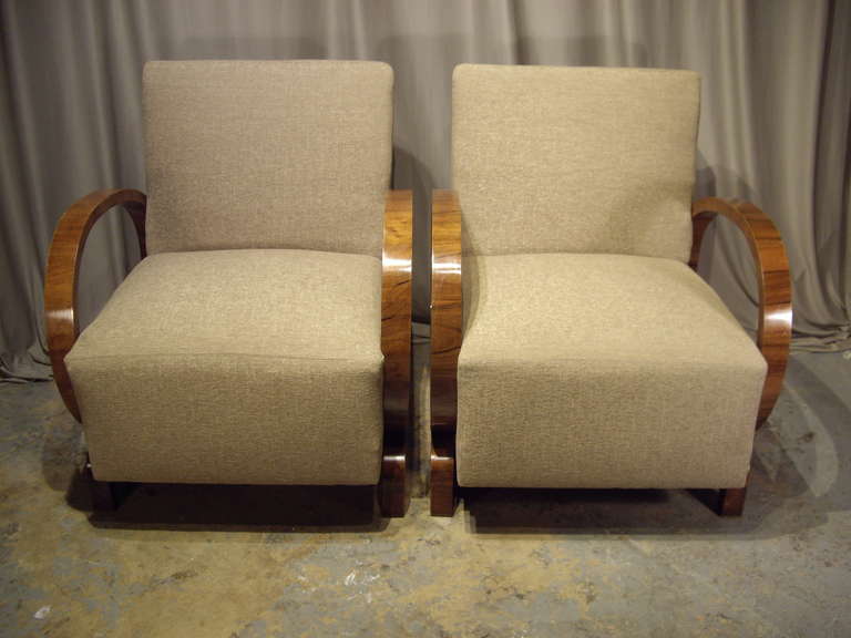 Pair of restored Art Deco walnut armchairs. New fabric and upholstery.