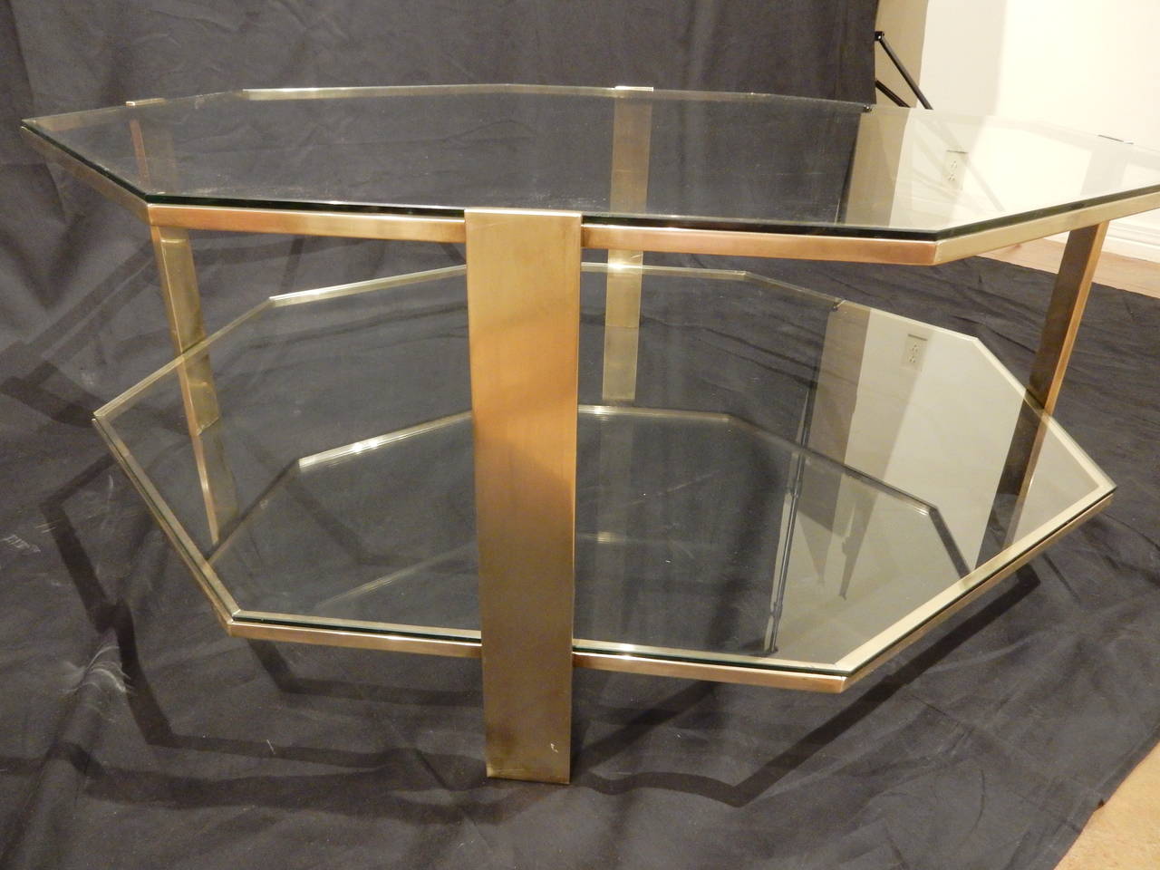 Beautiful quality bronze octagon shaped coffee table with glass shelf. Expert craftsmanship.  Table from flat edge to flat edge is 39.50