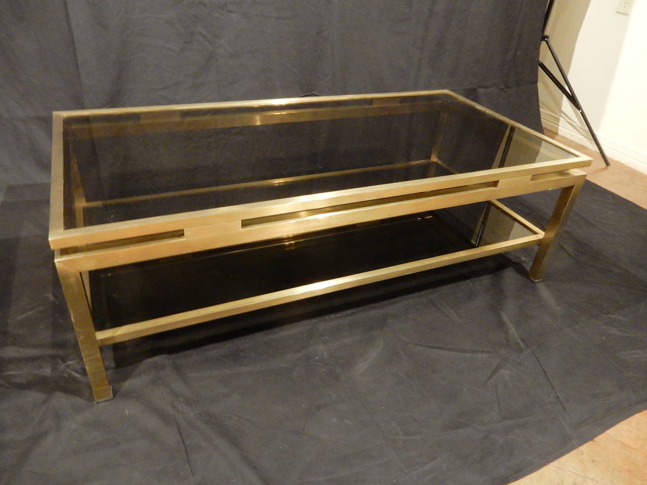 Guy  Lefevre quality brass coffee table with smoked glass on top and shelf. Not many with bottom shelf.
