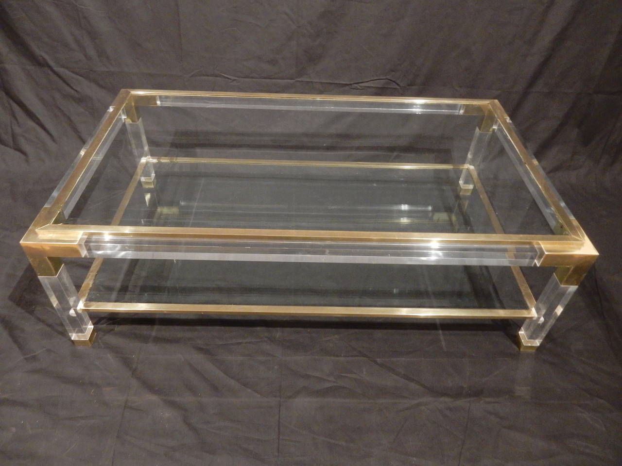 Mid-Century French brass, Lucite and glass rectangular coffee table. Top glass is movable and edges are fitted with slip on brass trim. Very good quality.