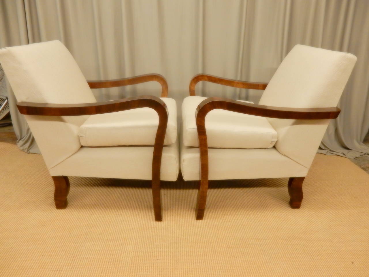 Pair of restored French Art Deco walnut armchairs. New fabric and upholstery.