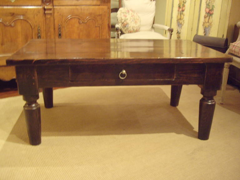 Restored 19th century farm table with one draw cut down to coffee table height.