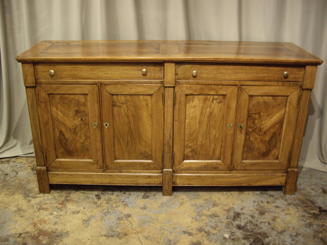 Beautiful honey colored early 19th century walnut French enfilade sideboard.