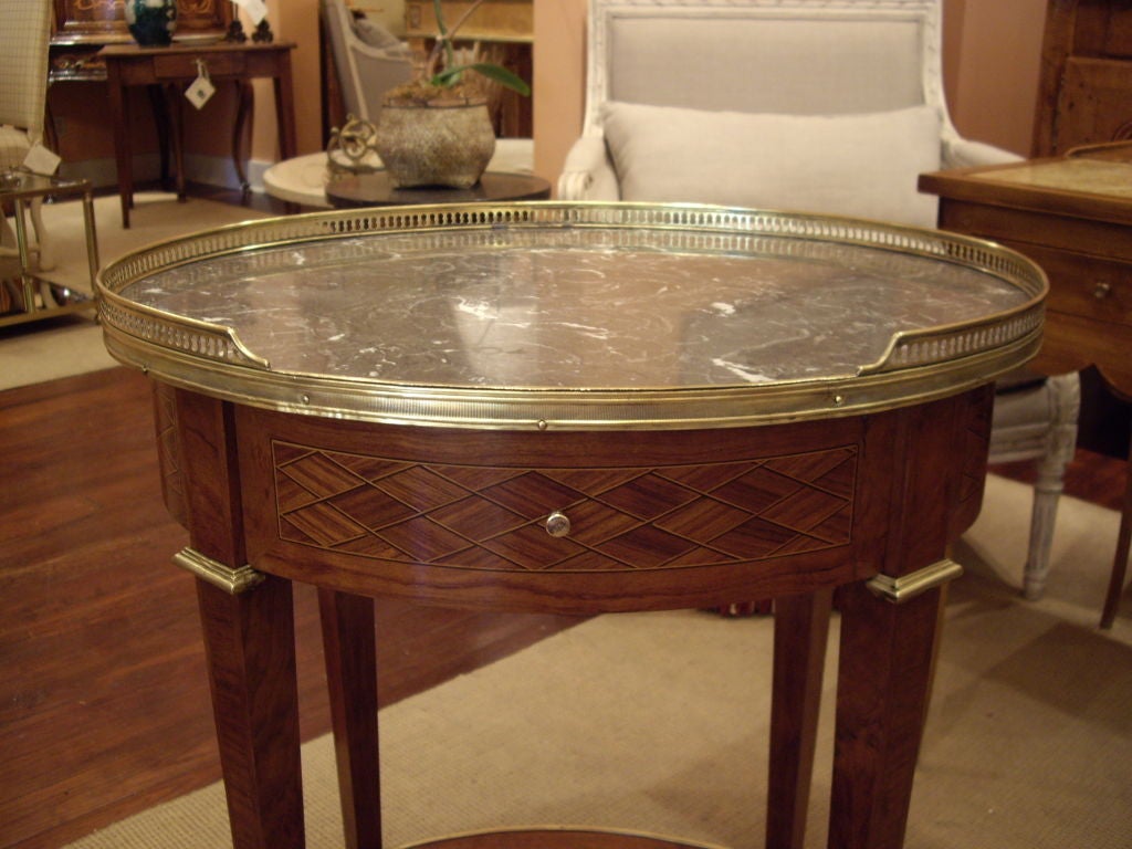 French Oval inlaid Louis XVI side table