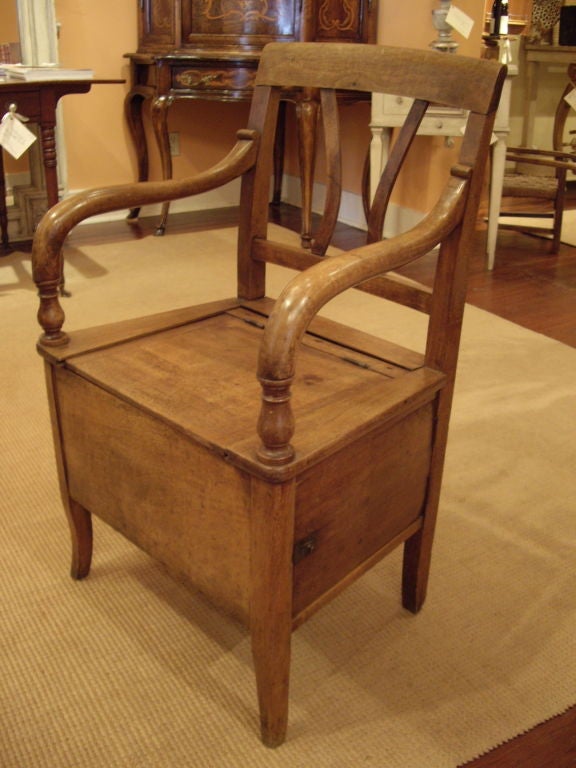 Very nice walnut French 19th century potty arm chair. Top and side open up.