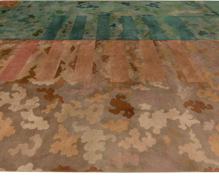 A vintage Chinese Deco rug with a bold modern design, half in shades of green and half in shades of brown, the two halfs linked by horizontal stripes.