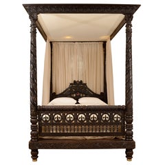 A Finely Carved Anglo-Indian Ebonized Mahogany Tester Bed