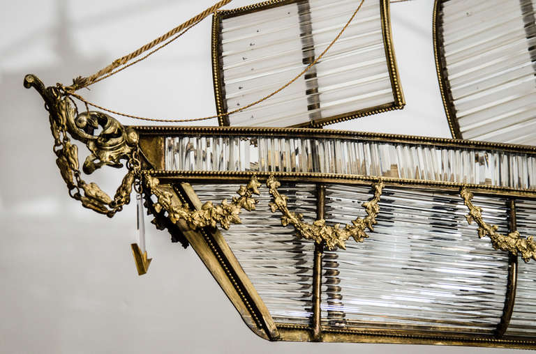 The giltwood masts hung with gilt chains and above three sails of horizontal crystal rods within gilt-metal frames. The ship body comprised of a top rail of vertical crystal rods over a hull of vertically mounted crystal rods with gilt- metal