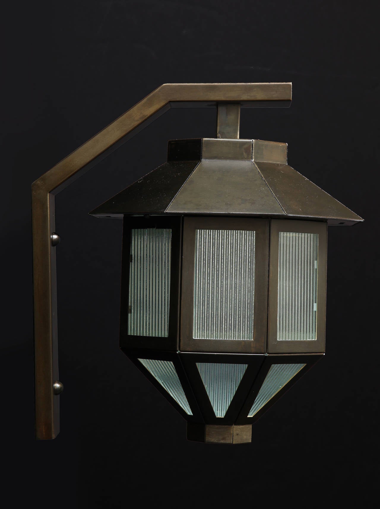 A Pair of Patinated Octagonal Shaped One Light Lanterns With Ribbed Halophane Glass Panels.  Each Lantern Is Supported By An Armature.  
Can Be Used Out Side In A Portico Style Setting.

 For More Information Please Click On Dealer Contact.