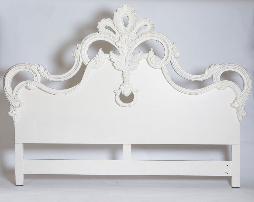 Painted white wood headboard reminiscent of Dorothy Draper and Tony Duquette - stylish!