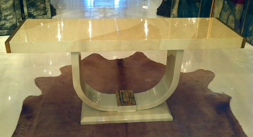 Beautiful console from the Roosevelt hotel in Los Angeles, CA.  The painted finish has the look of marble, and the two ends and bottom center detail are gilded.