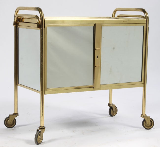 Fabulous mirrored and brass bar cart by Pierre Cardin.  The interior has storage for glasses, stemware, and bottles.  This is great for a holiday party!