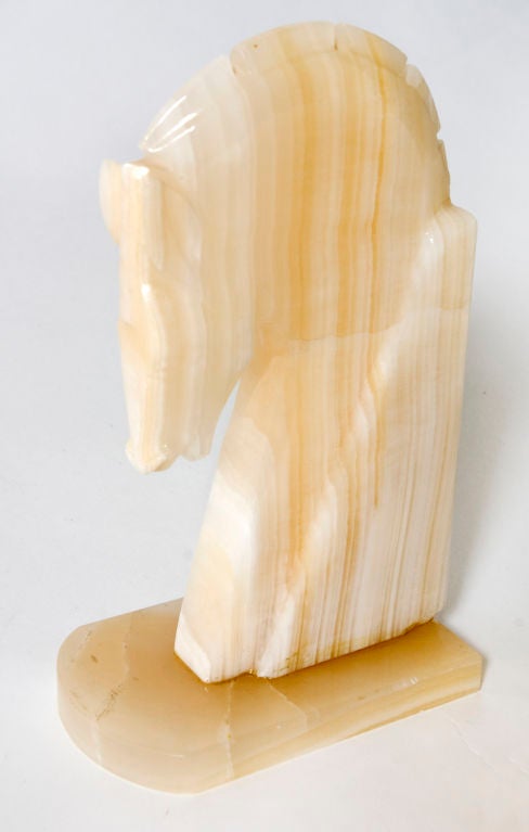 Horse head shaped onyx bookends.  Priced as a pair.