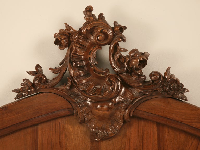  Antique French Rococo solid walnut headboard, with a beautifully hand-cared detail at the top and probably made just before or after c1900. The headboard is just about the width of an American full size mattress which is roughly 54