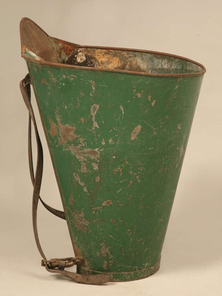 The perfect accessory for your wine cellar.These metal  hod's were worn by  grape pickers in the French countryside. This one has it's original green paint and leather back straps.