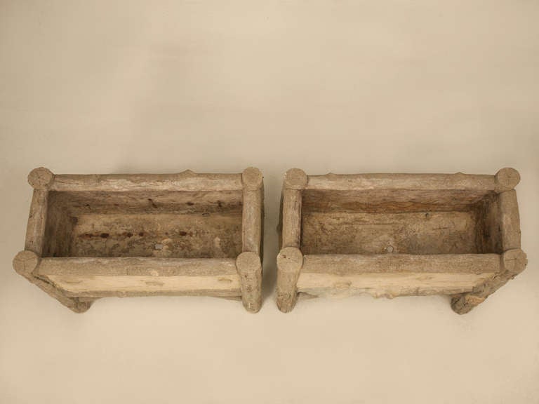 Pair of vintage French faux bois planters. Made from concrete to look like real wood, they would enhance any garden. They are in good condition but please note a very amateur repair along the bottom decoration as shown in image 5. These planters are