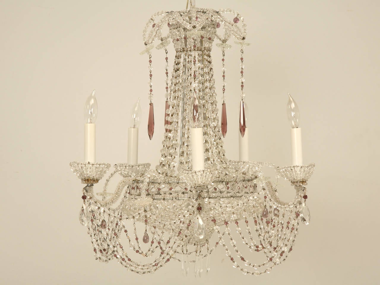 Vintage Italian Chandelier with matching silver-leafed canopy. Unequivocally the most heavily beaded light I have ever seen, even the Bobeches are made from Beads. These is just a hint of amethyst in the cut crystal drops, which could always be