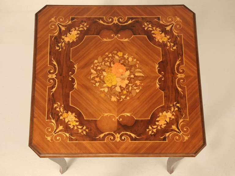 Purchased in the Chicago Merchandise Mart during the 1960's, this beautifully inlaid Italian game table can double as an end table, or fit nicely in the corner of a room flanked by two chairs.