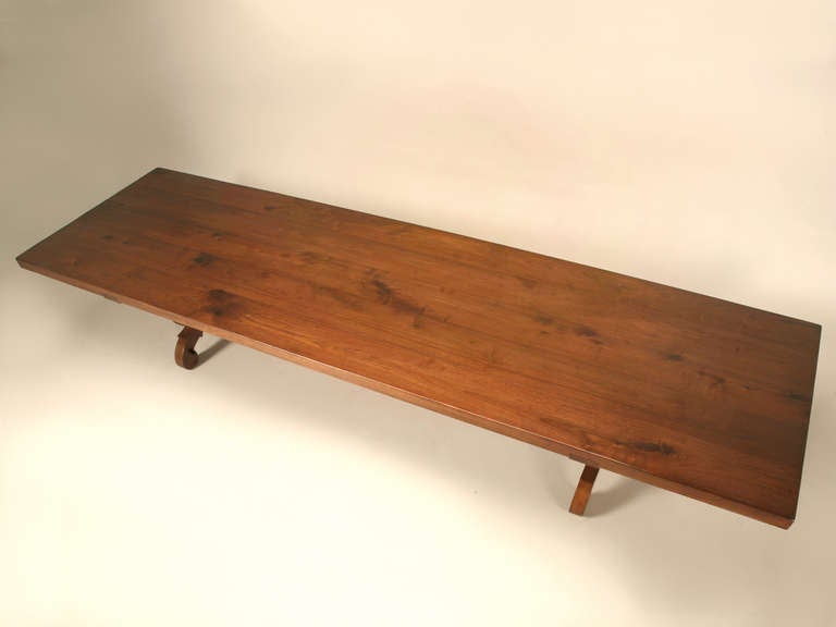 Heavens to Betsy, have you ever seen such a breathtaking table? Handmade utilizing old world techniques and craftsmanship, this table will feed an entire gaggle of folks. Constructed from 3” thick solid walnut planks, this table has all the look of