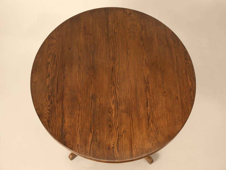 Made from reclaimed Oak, this tabletop sits on an English-imported Pedestal Base and has a beautiful patina applied to give it a rich appearance. Per usual with our custom pieces, this Round Dining Room or Kitchen Table is available is several sizes