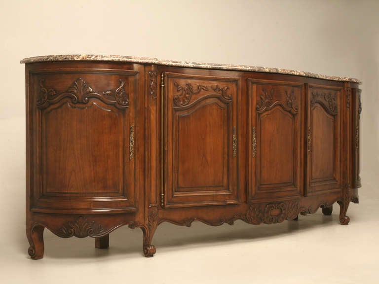 Beautiful circa 1930's French cherrywood Louis XV style buffet, with a thick marble top that includes dark cherry color veins that match the buffet almost perfectly. Completely restored both inside and out in our Old Plank workshop. Interior is