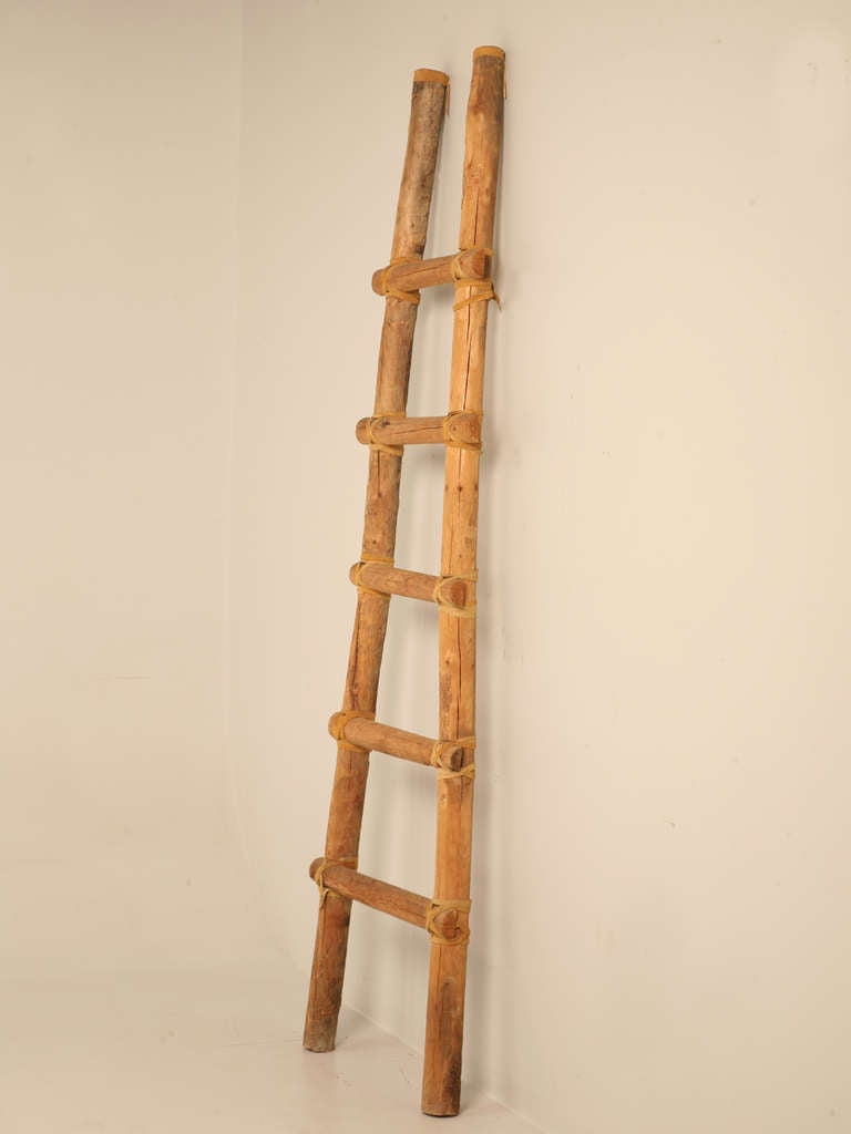Large vintage American adobe “A” form kiva ladder with irresistible charm and character is perfect for displaying articles in rooms with a loft or vaulted ceilings. This stunning ladder may also be utilized outdoors as a perfect spot for drying