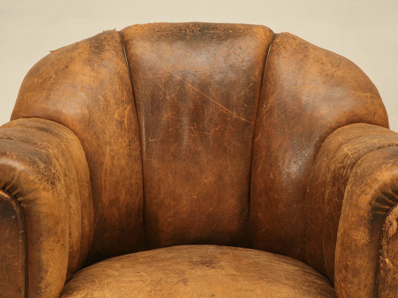 In trying to describe this old leather French chair, I do not really know if it was a club chair, or living room chair, or possibly from a gentleman's office? What I do know is that this is the epitome of what a chair should sit like. We stock over