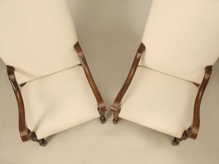 Circa 1800-1820 completely handcarved pair of original antique French white oak Louis XIII armchairs. Our Old Plank workshop have thoroughly rebuilt the chairs from the frame up, including proper horsehair padding and are now ready for your