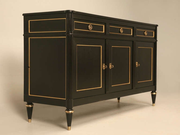 Louis XVI style Ebonized mahogany Buffet, Handcrafted in our Old Plank cabinetry department here in Chicago. All the solid brass hardware is imported from Europe, and the Ebonized Finish is applied the old fashion way by hand, you can still see