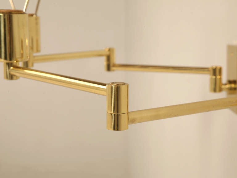 Spanish Pair Solid Brass Swing Arm Sconces by Hansen New York