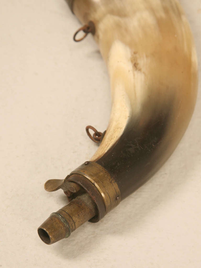 19th century French powder horn. Beautiful patina on brass detailing.