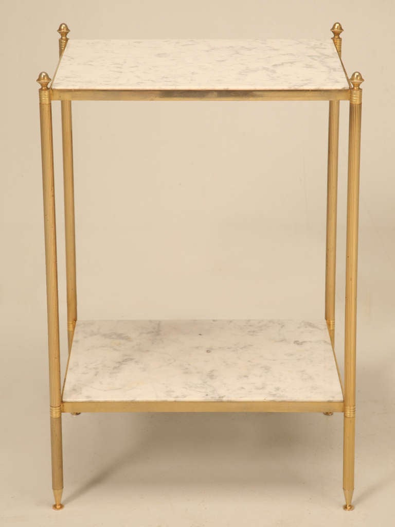 Vintage French marble and brass plated steel side table. There are a couple of areas where the plating has come off and a scratch on the top piece of marble (seen on the left side of image 4).

** The height provided includes the 1