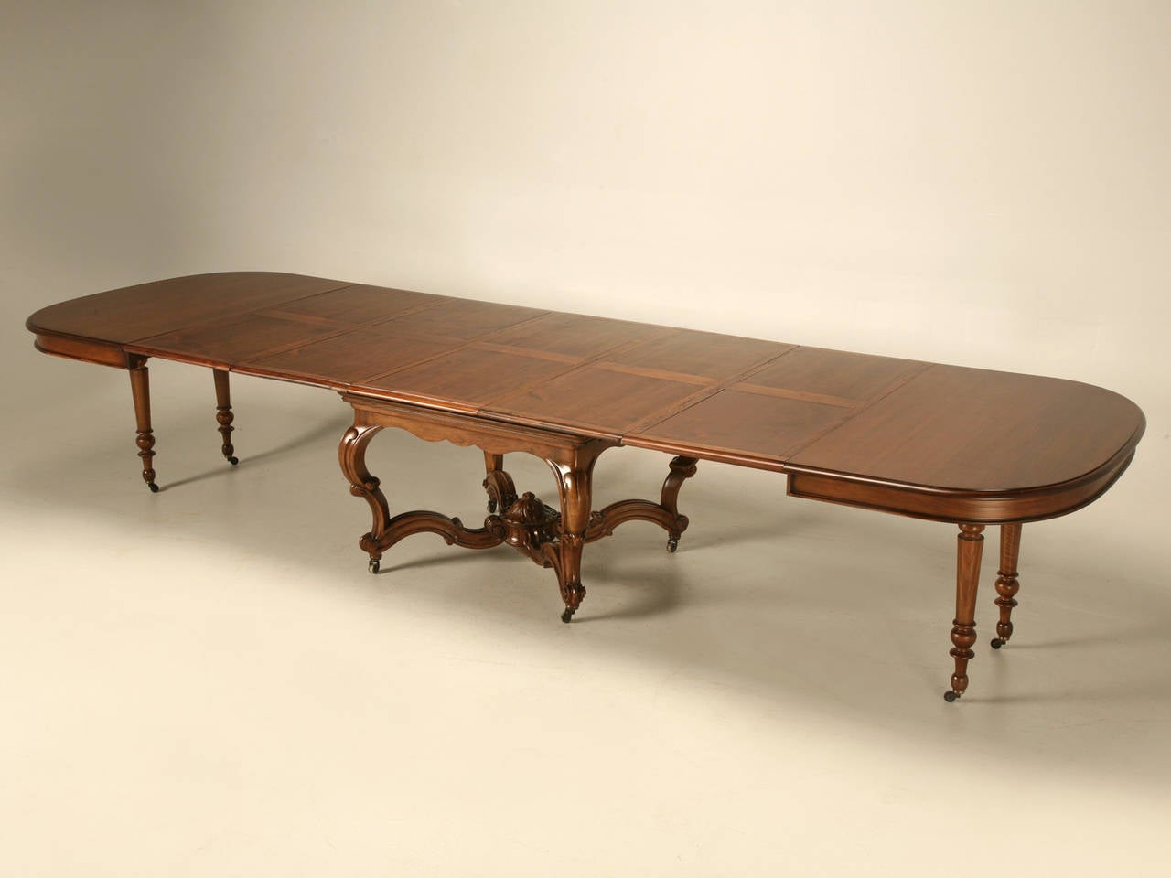 Antique French walnut dining table from Ch. Jeanselme & C°, Paris, who were a supplier of furniture to the Imperial Courts of France, circa 1890. Opened in 1824 as Jeanselme Freres, with the stamp changing to 'Ch. Jeanselme et Cie' in 1883 which was
