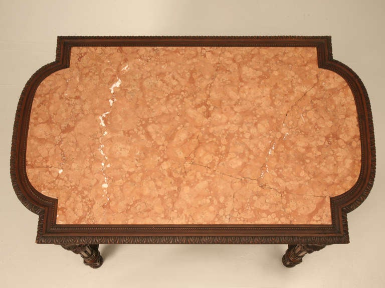 Spectacular original antique French Louis XVI center hall or library table with it's original marble top. Rarely do we encounter such masterpieces but, our buyers were working extra hard the day they spotted this. The unique rectangular shape with