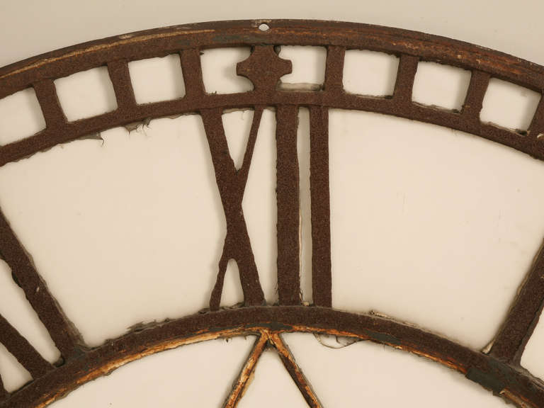 Cast iron clock face found in the village of Haworth which is situated at the edge of the Pennine moors in West Yorkshire, England circa 1860, the area made famous by the Bronte sisters, unfortunately over the years most of the white milk glass has