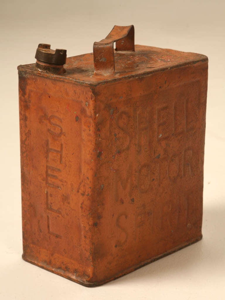 Whoa! How long has it been since you've actually laid your eyes on one of these. This awesome gasoline can not only retains its original orange finish but, proudly distinguishes Shell Motor Spirits as its contents. These are the items car collectors