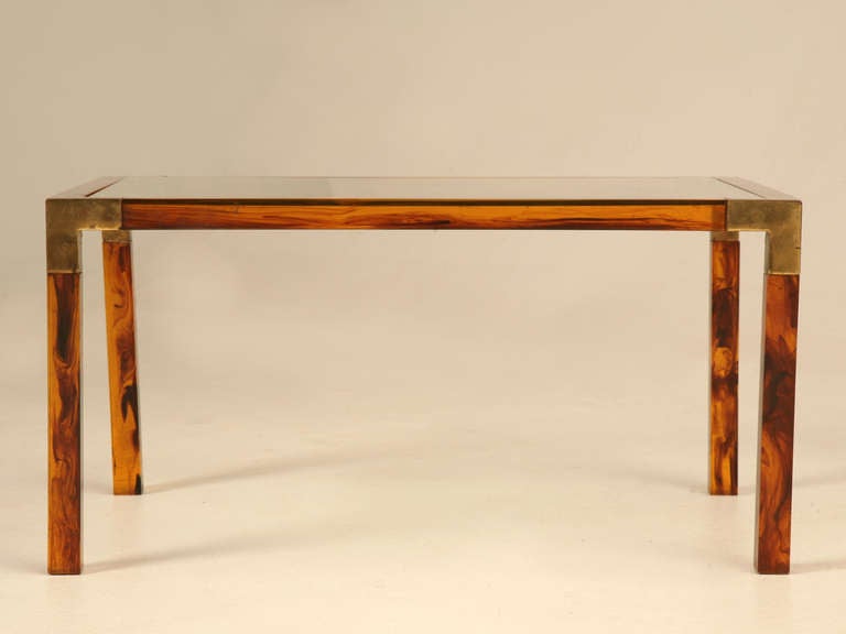 Circa 1960's faux tortoise shell acrylic and brass petite French coffee table. This has to be one of the most unusual and elegant tables we have ever had, and I am sure they were mass produced, but we have never seen one before. Please note the