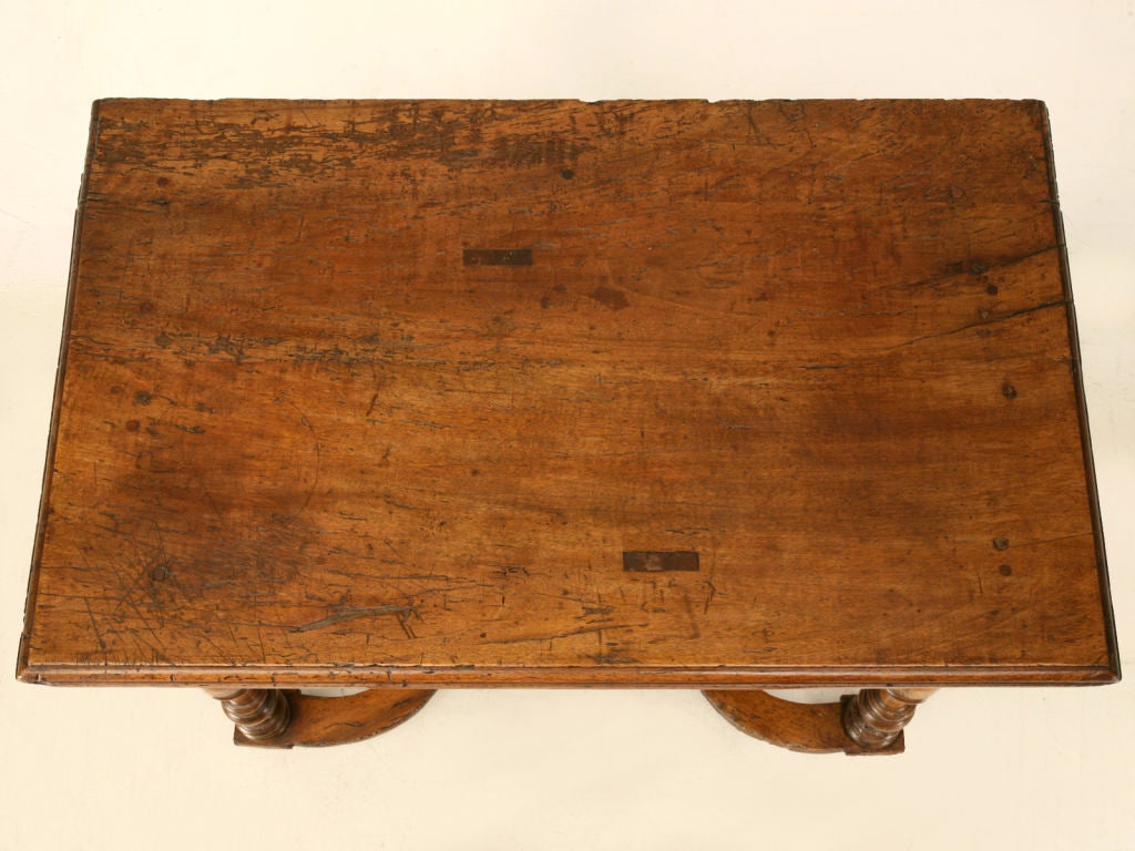 Eighteenth century French fruitwood writing table with full-width single hand-dovetailed drawer. Composed of several interesting design elements, this table is certainly one-of-a-kind. This fine table has not only a unique design aesthetic but, also
